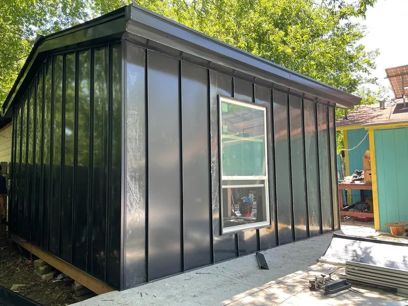 Black standing seam metal wall panels for Roof Inspection in Tisbury